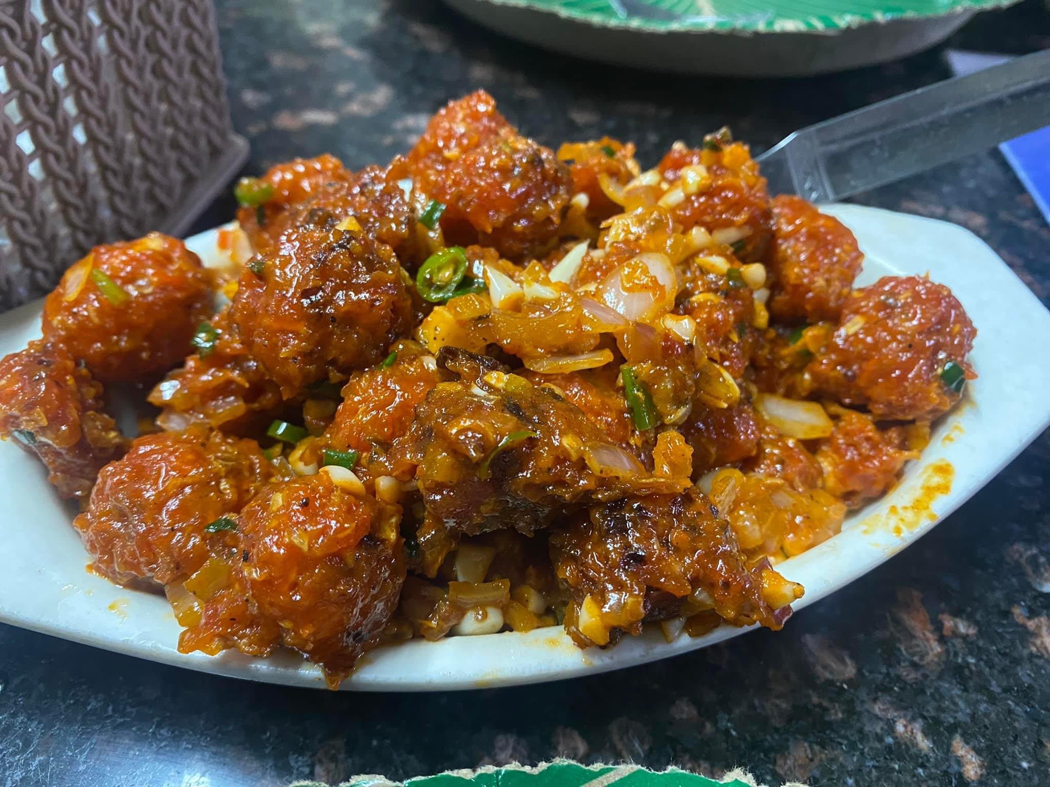 A plate of spicy garlic chili chicken served as a starter